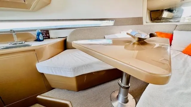 Slide: The Image of Interior of 2018 Canard Yachts eMotion HYBRID, featuring modern seating and table design. - 21