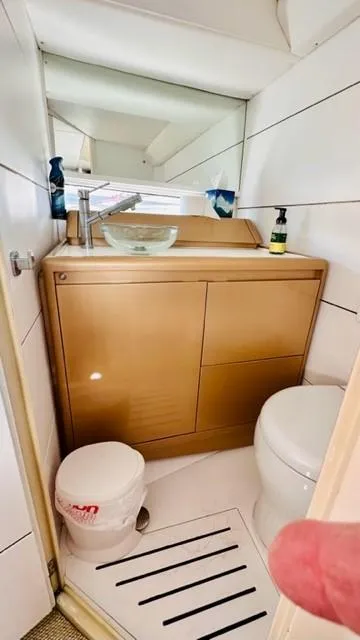 Slide: The Image of Luxurious bathroom in 2018 Canard Yachts eMotion HYBRID with modern fixtures and elegant design. - 19