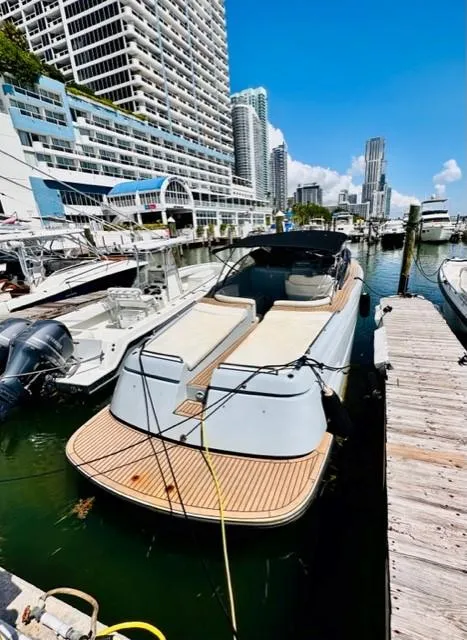 Slide: The Image of Luxury Canard Yachts eMotion HYBRID 2018 docked in a marina, surrounded by skyscrapers. - 10