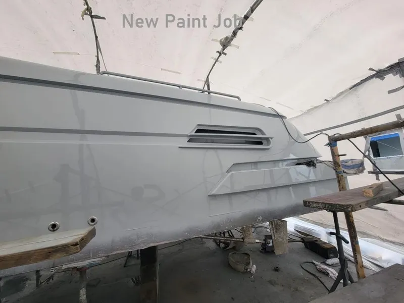 Slide: The Image of 2018 Canard Yachts eMotion HYBRID undergoing a new paint job in a workshop. - 26