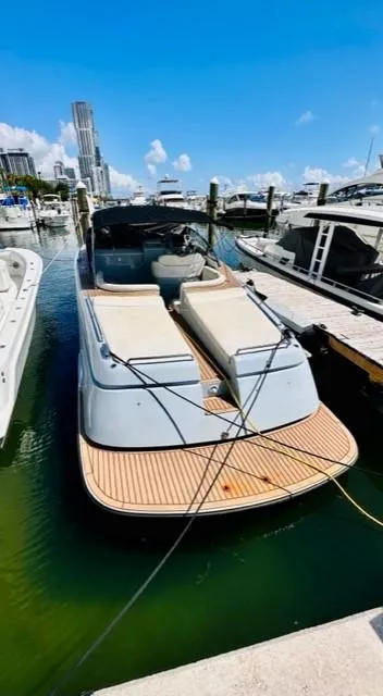 Slide: The Image of 2018 Canard Yachts eMotion HYBRID docked at marina, sunny day, city skyline background. - 11