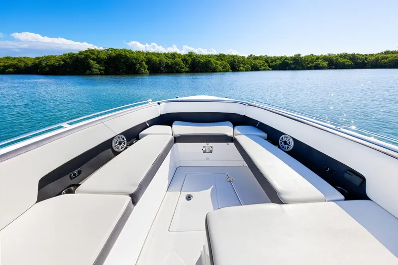 Slide: The Image of The image shows the bow of a 2017 Monterey 378SE Super Express on calm water. - 11
