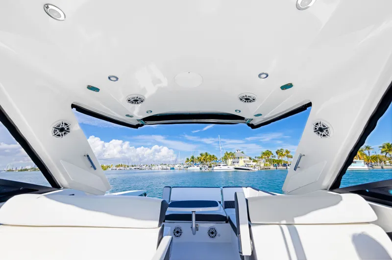 Slide: The Image of View from the cockpit of a Monterey 378SE Super Express overlooking water and other boats. - 34