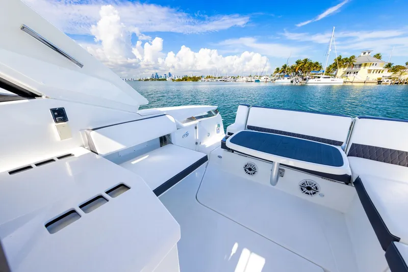Slide: The Image of The image shows the deck of a 2017 Monterey 378SE Super Express overlooking the water. - 33