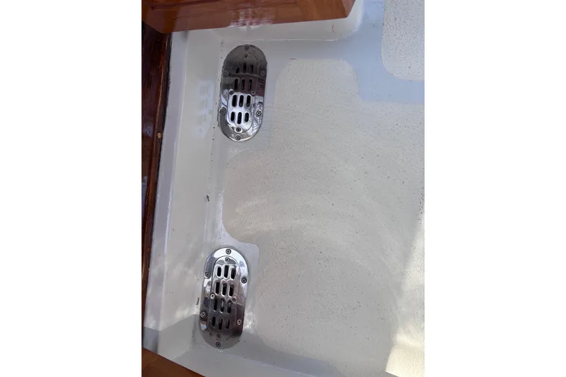 Slide: The Image of Stainless steel drains on a 1978 Swift 33 boat deck. - 52
