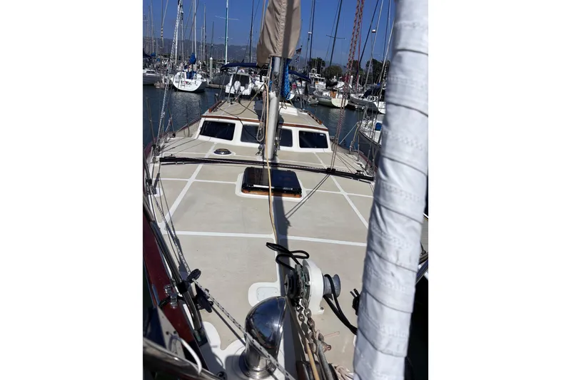 Slide: The Image of 1978 Swift 33 sailboat deck view in marina, surrounded by other boats. - 7