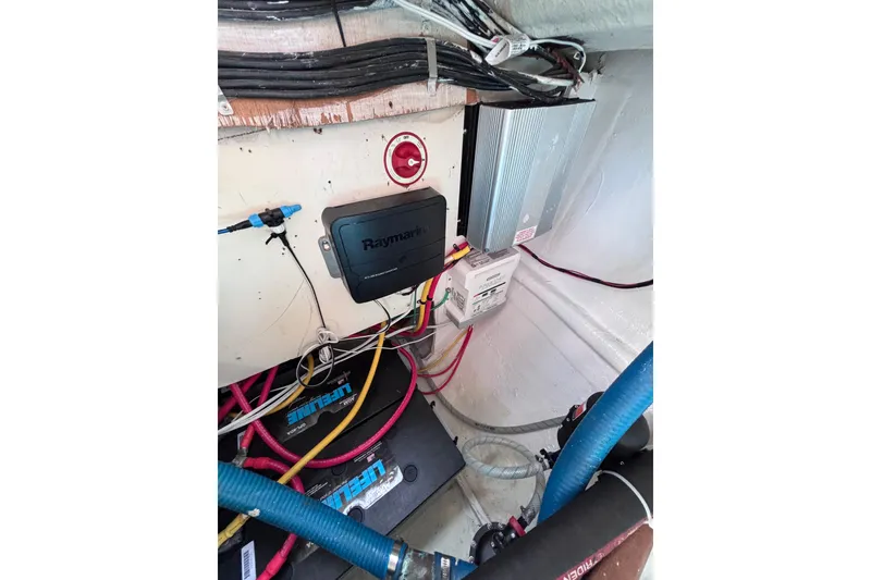 Slide: The Image of Electrical system setup in a 1978 Swift 33 boat, featuring Raymarine equipment and wiring. - 50