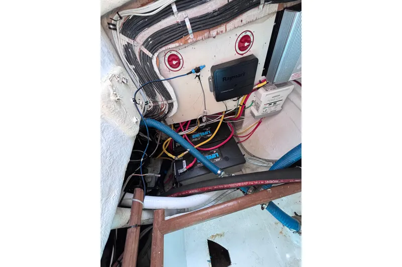 Slide: The Image of Electrical wiring and components inside a 1978 Swift 33 boat. - 49