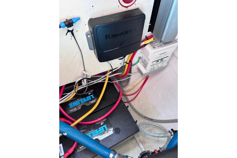 Slide: The Image of Electrical system setup in a 1978 Swift 33 boat, featuring Raymarine components and Lifeline batteries. - 53