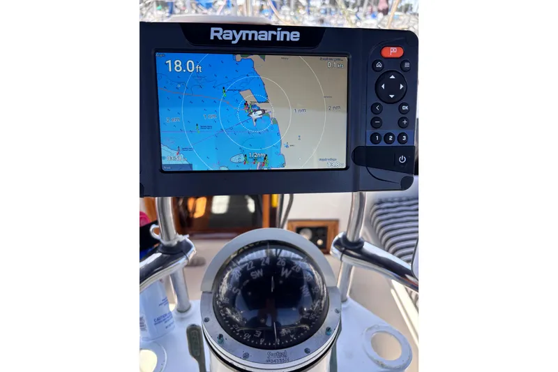 Slide: The Image of Raymarine navigation system and compass on a 1978 Swift 33 boat. - 24