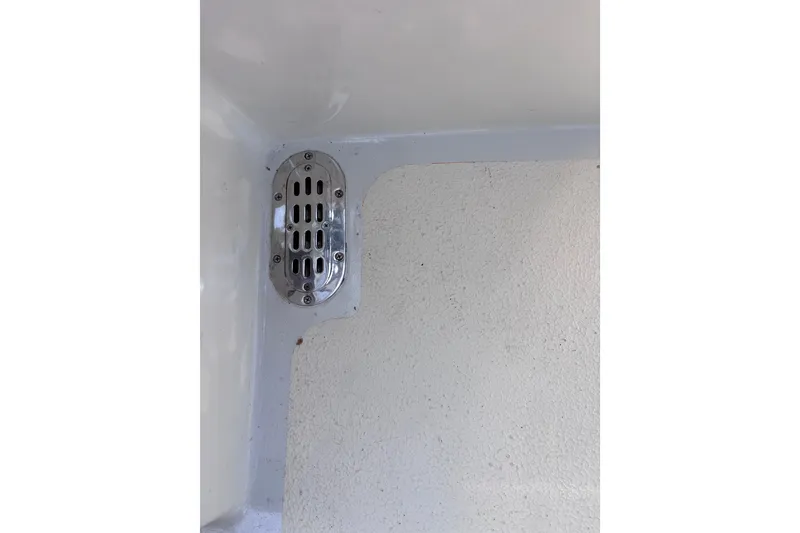Slide: The Image of Chrome drain cover on 1978 Swift 33 boat interior. - 59