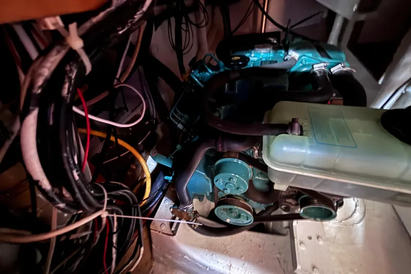 Slide: The Image of Engine compartment of a 1978 Swift 33, showcasing wiring and mechanical components. - 39