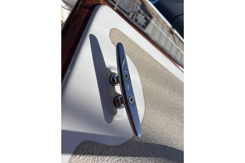Slide: The Image of Chrome boat cleat on a 1978 Swift 33, mounted on textured surface. - 62