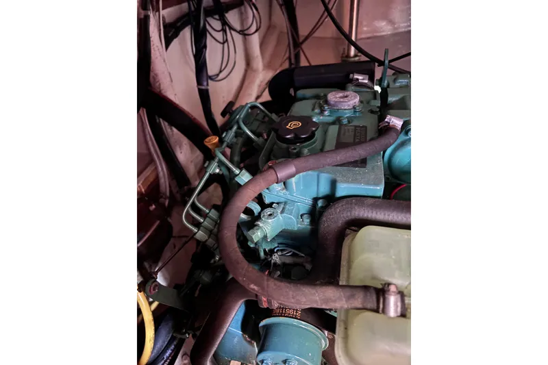 Slide: The Image of 1978 Swift 33 engine compartment with visible hoses and components. - 60