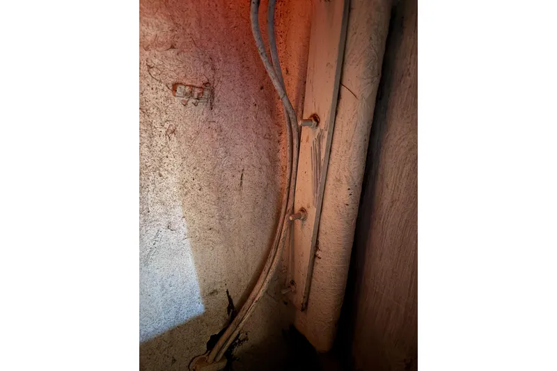 Slide: The Image of Old wiring inside a 1978 Swift 33, showing aged electrical components. - 42