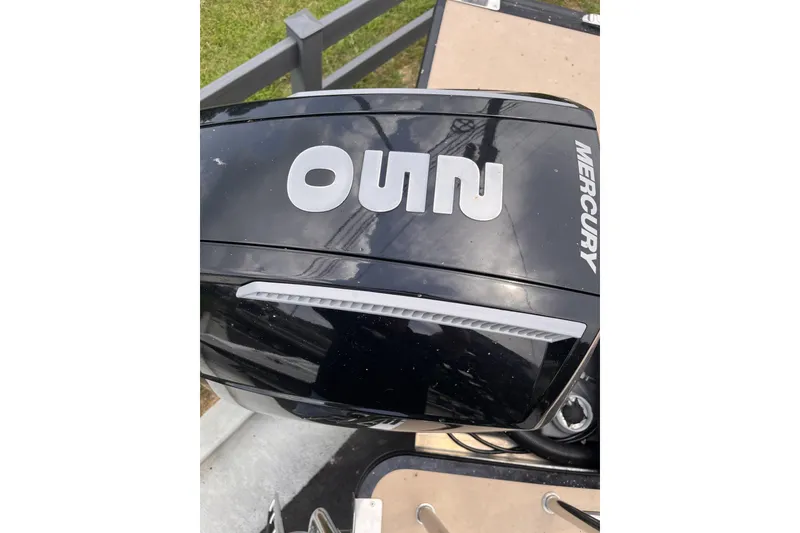 Slide: The Image of Outboard motor on a 2022 Harris Solstice 230 CWDH boat, featuring Mercury branding. - 8