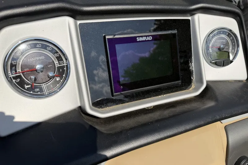 Slide: The Image of Dashboard of 2022 Harris Solstice 230 CWDH with Simrad display and gauges. - 3