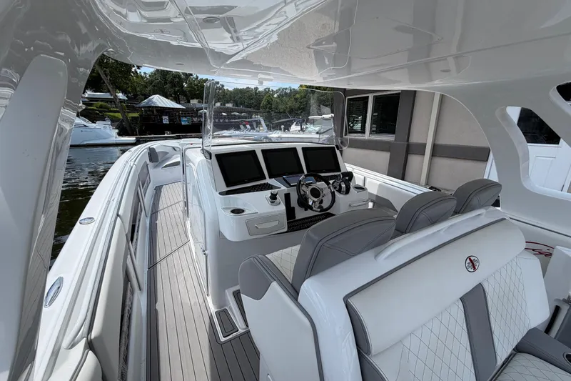 Slide: The Image of 2015 Cigarette 41' Nighthawk SD Edition boat interior with sleek design and advanced navigation systems. - 4