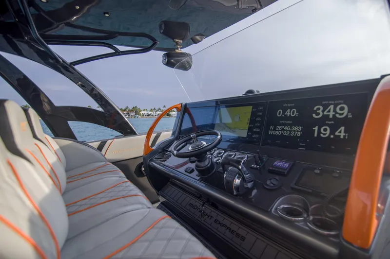 Slide: The Image of Interior view of 2019 Midnight Express 43 Open boat cockpit with advanced navigation system. - 6