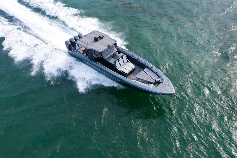 Slide: The Image of 2019 Midnight Express 43 Open boat cruising on open water, aerial view. - 24