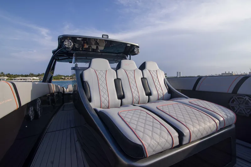 Slide: The Image of Luxurious seating on a 2019 Midnight Express 43 Open boat, featuring sleek design and waterfront view. - 11