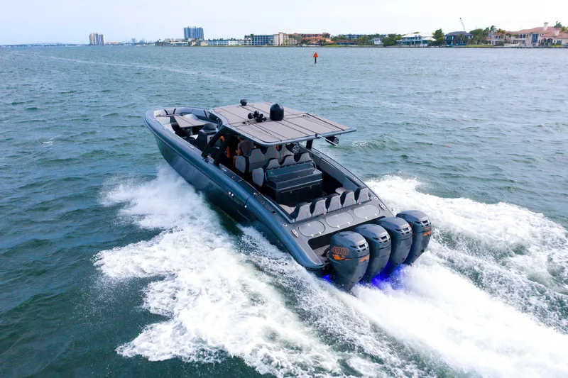 Slide: The Image of 2019 Midnight Express 43 Open boat cruising on water with powerful engines. - 22