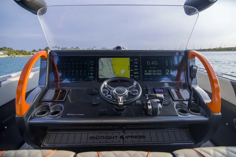 Slide: The Image of Cockpit of 2019 Midnight Express 43 Open boat with advanced navigation system. - 5