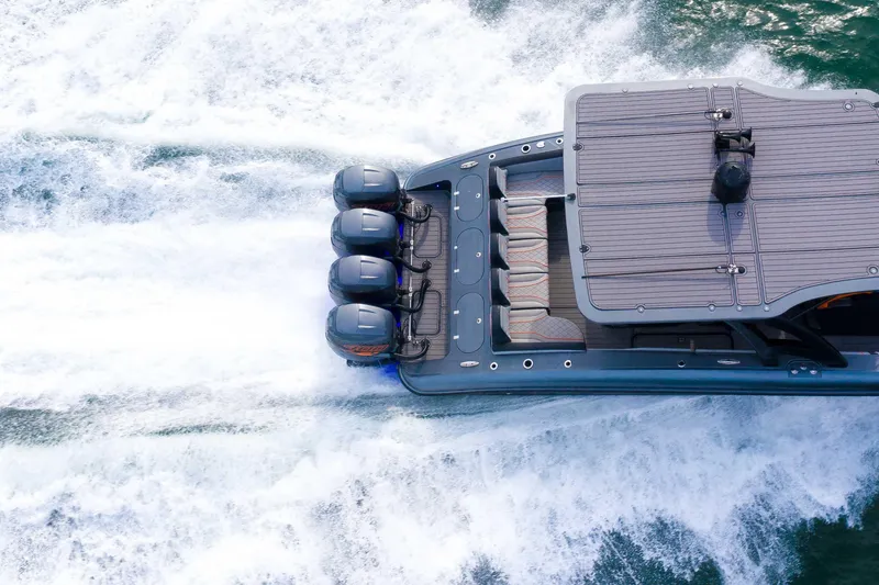 Slide: The Image of 2019 Midnight Express 43 Open boat speeding on water, aerial view. - 23