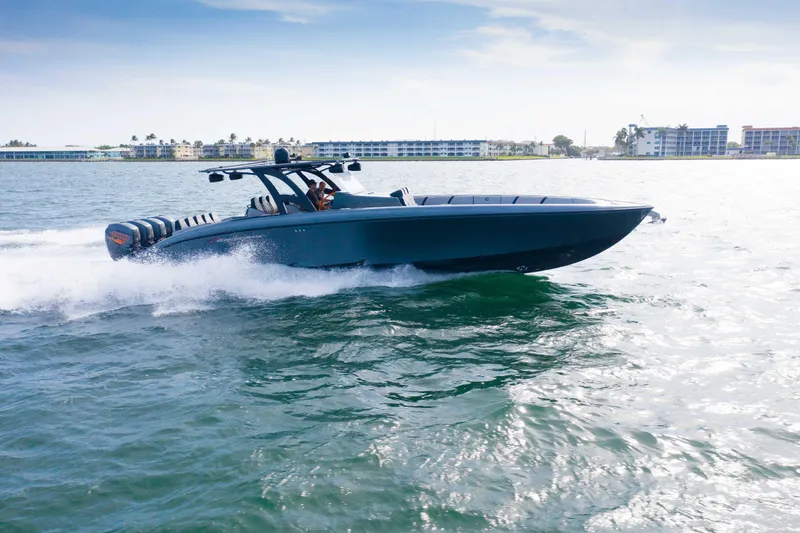 The Image of 2019 Midnight Express 43 Open boat cruising on water, showcasing sleek design and powerful engines. - 1