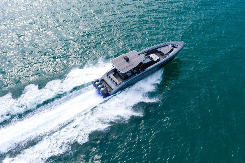 Slide: The Image of Aerial view of 2019 Midnight Express 43 Open boat speeding on ocean waters. - 27
