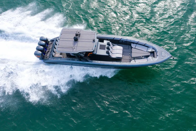 Slide: The Image of Aerial view of 2019 Midnight Express 43 Open boat cruising on water. - 26