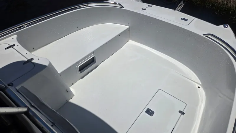 Slide: The Image of The image shows the spacious, open deck of a Glacier Bay Canyon Runner 2260 boat. - 14