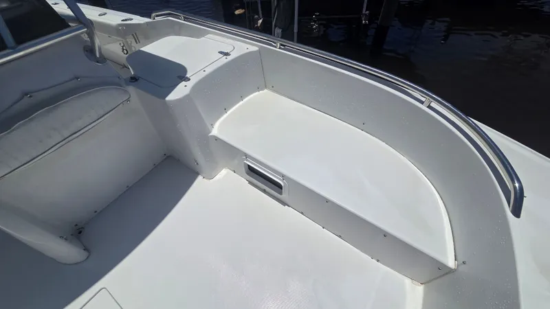 Slide: The Image of The image shows the deck of a 2001 Glacier Bay Canyon Runner 2260 boat. - 15