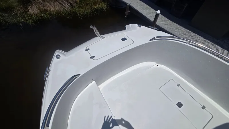Slide: The Image of The boat features a spacious foredeck with storage hatches and a railing. - 17