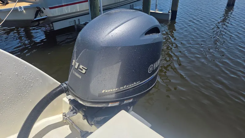 Slide: The Image of A Yamaha 115 horsepower outboard motor on a boat in the water. - 6