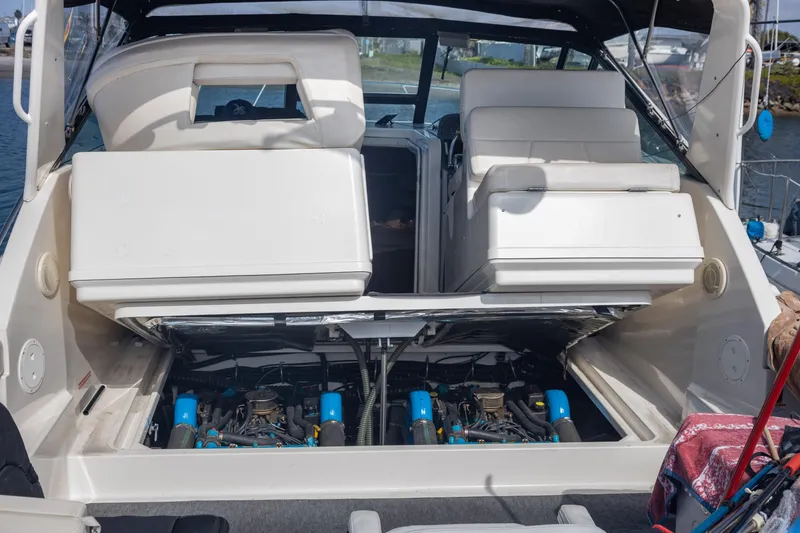 Slide: The Image of 1995 Tiara Yachts 3100 Open with engine compartment exposed, showcasing dual engines. - 22