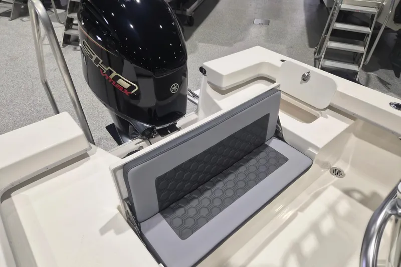 Slide: The Image of 2026 Defiance 205 Catalina boat with sleek seating and powerful outboard motor. - 6