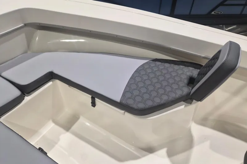 Slide: The Image of Interior seating of 2026 Defiance 205 Catalina boat with gray cushioned upholstery. - 14