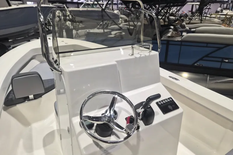Slide: The Image of Steering console of 2026 Defiance 205 Catalina boat, featuring modern controls and sleek design. - 9