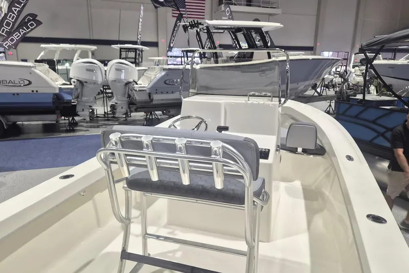 Slide: The Image of 2026 Defiance 205 Catalina boat interior at a marine exhibition, showcasing seating and helm. - 4