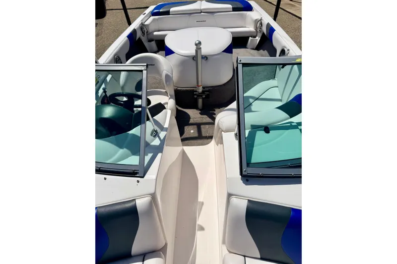 Slide: The Image of 2008 Moomba Outback V boat interior with blue and white seating and windshield. - 58