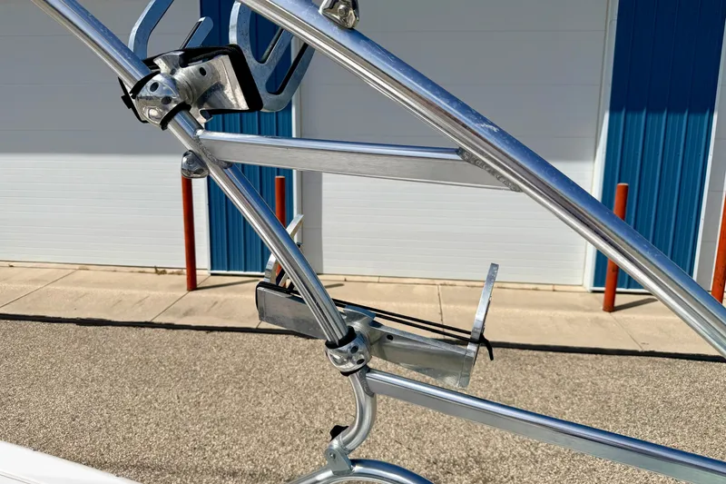 Slide: The Image of 2008 Moomba Outback V boat tower with wakeboard rack, outdoor setting. - 62