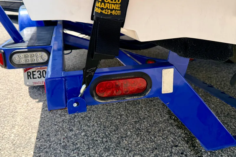 Slide: The Image of 2008 Moomba Outback V trailer with blue frame and red tail lights. - 70