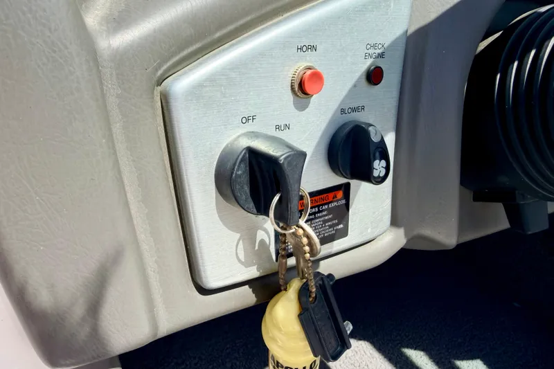 Slide: The Image of 2008 Moomba Outback V ignition panel with keys, horn, and blower controls. - 41