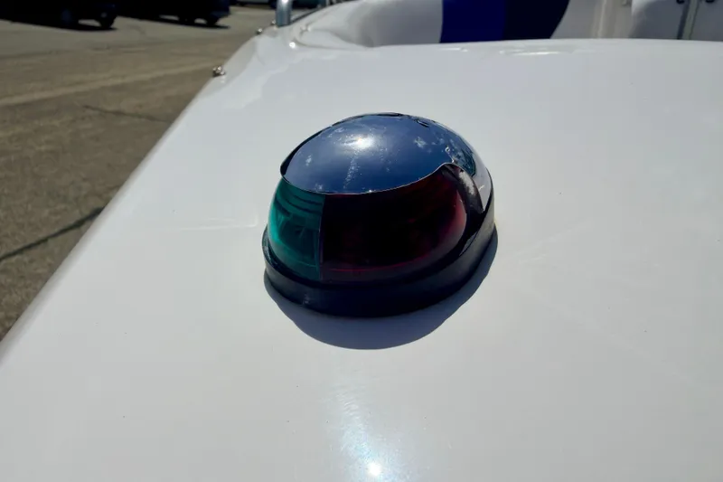 Slide: The Image of Navigation light on 2008 Moomba Outback V boat, featuring red and green lenses. - 63