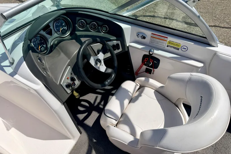 Slide: The Image of 2008 Moomba Outback V boat cockpit with steering wheel and gauges. - 35