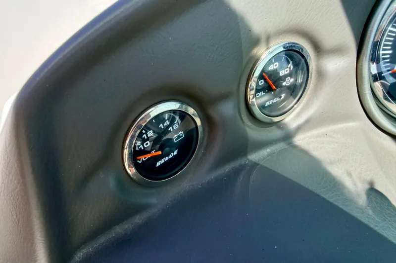 Slide: The Image of Dashboard gauges of a 2008 Moomba Outback V boat, showing voltage and oil pressure. - 40
