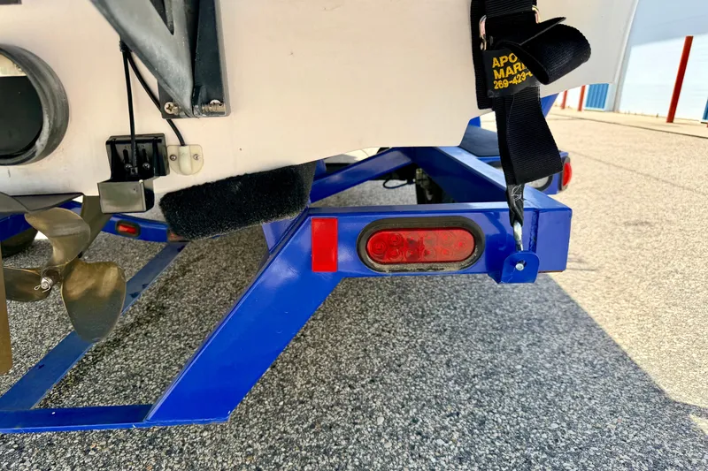Slide: The Image of 2008 Moomba Outback V boat trailer with blue frame and visible propeller. - 71
