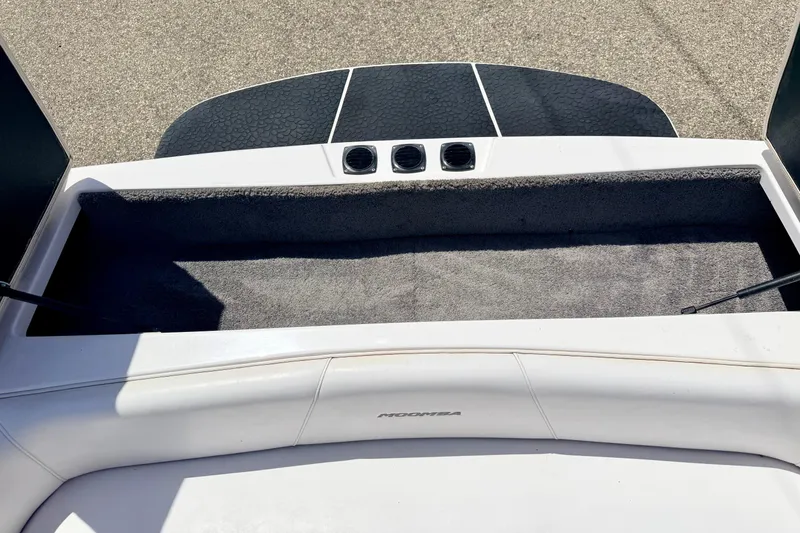 Slide: The Image of 2008 Moomba Outback V boat interior with storage compartment and cushioned seating. - 23