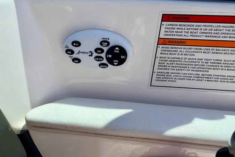Slide: The Image of Control panel and safety warnings on a 2008 Moomba Outback V boat. - 45